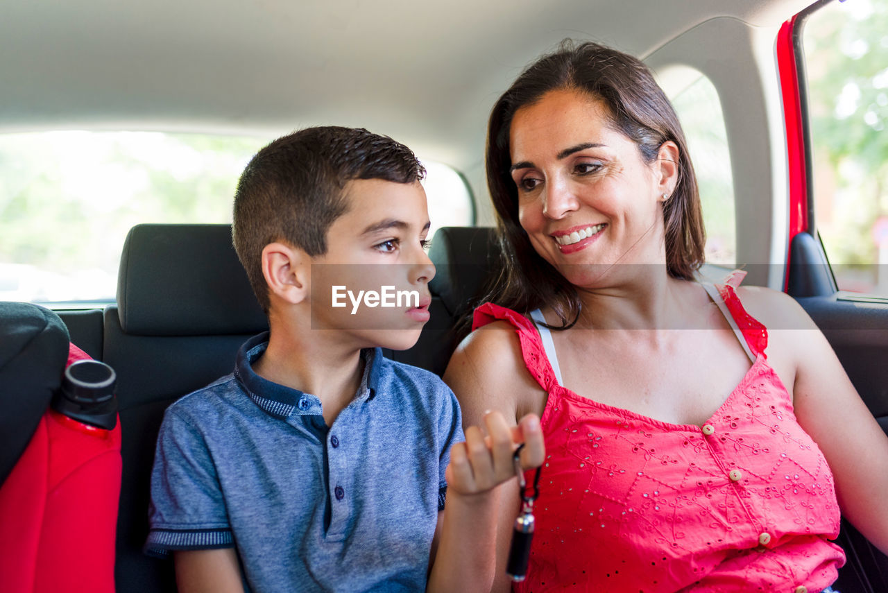 Mother and sun talking in a car