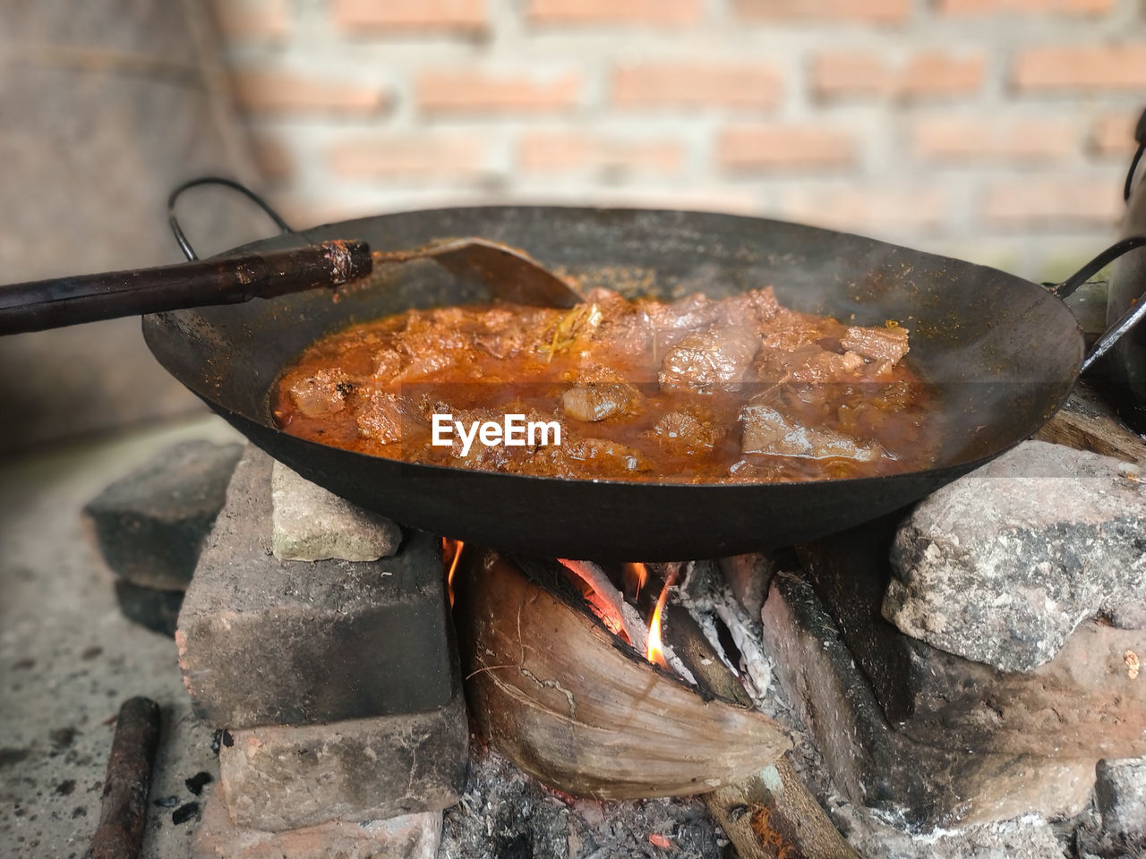 Traditional kitchen rendang making process