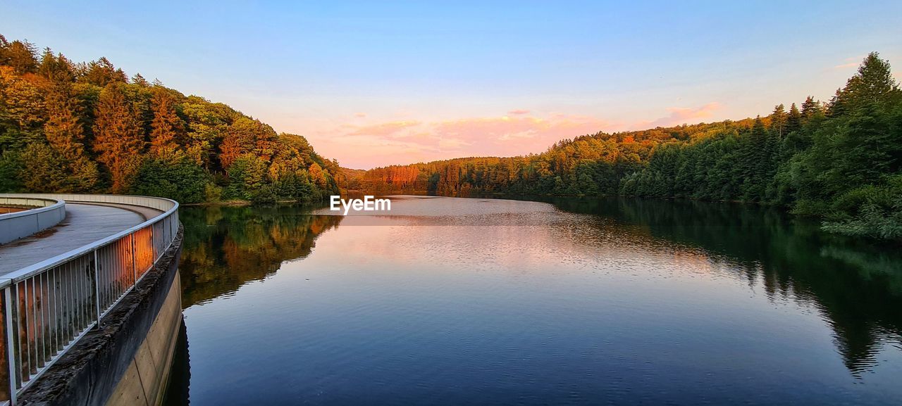 Scenic view of lake against sky during sunset