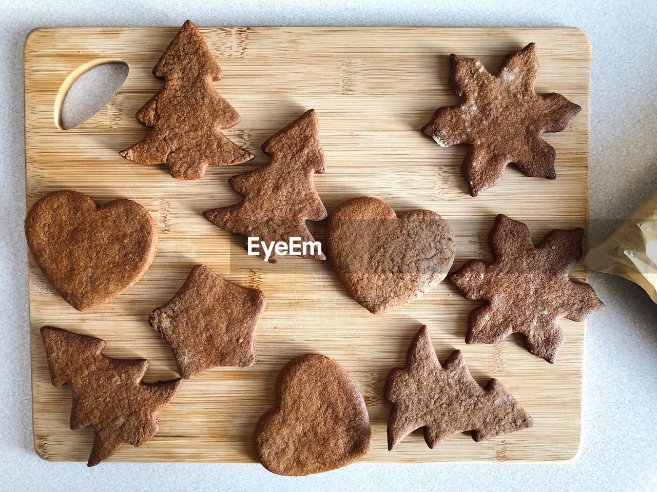 High angle view of cookies on cutting board