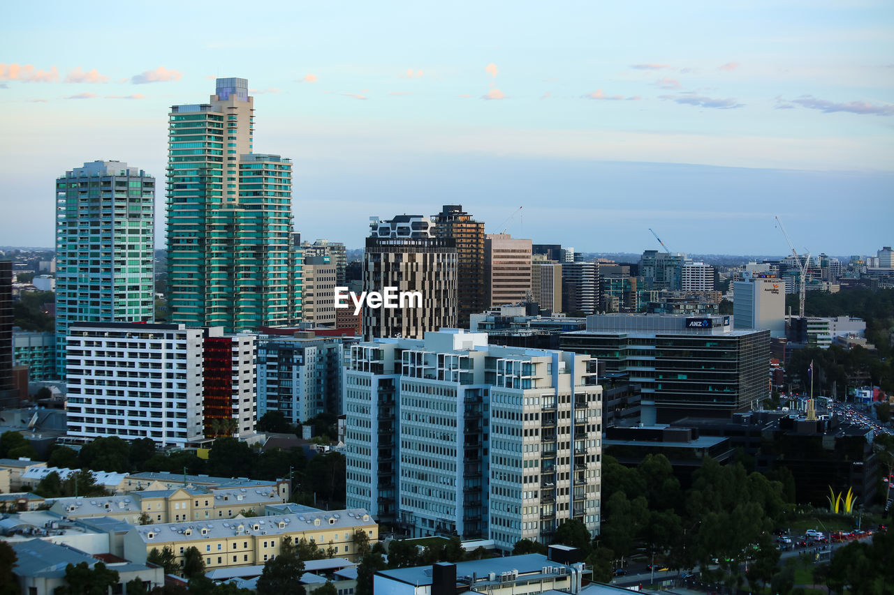 Modern buildings in city against sky