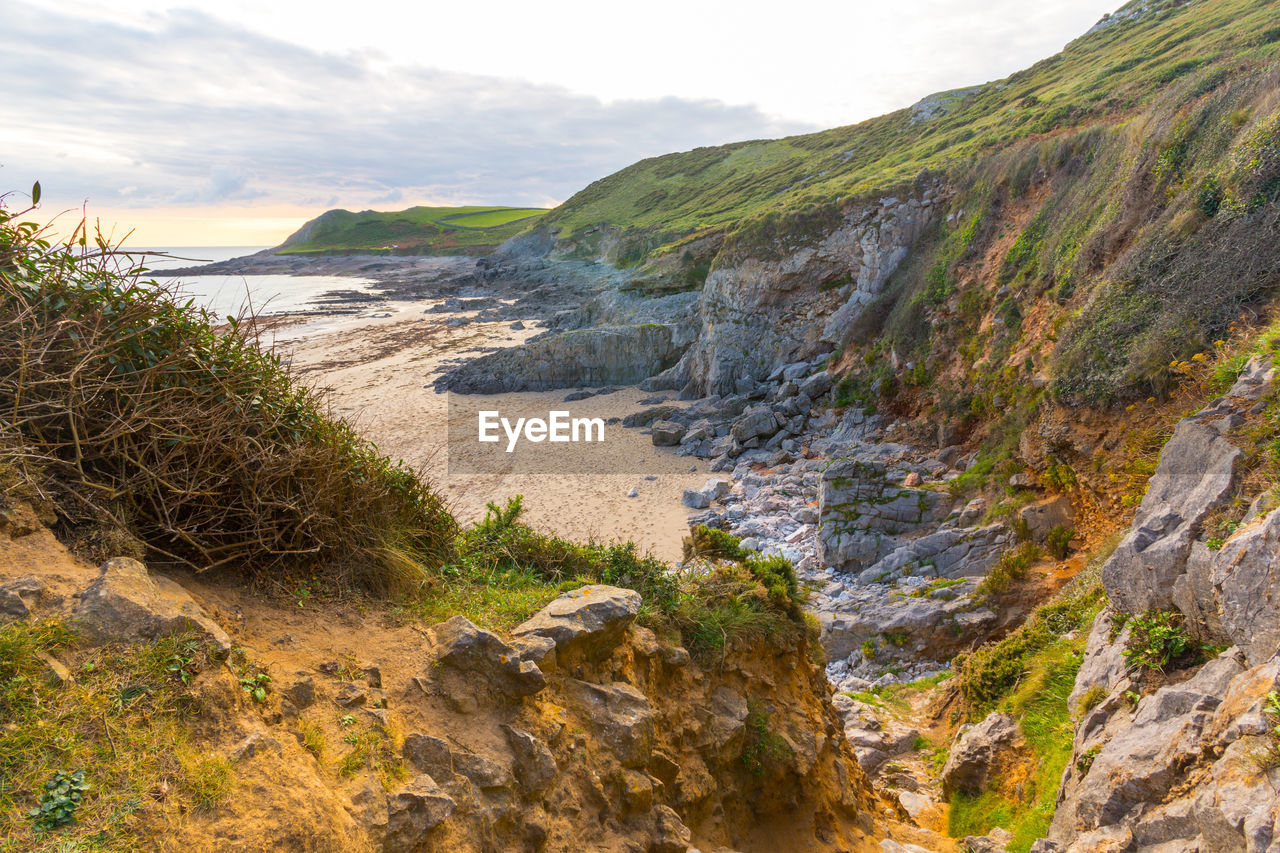 Scenic view of mountains against sky on the beach