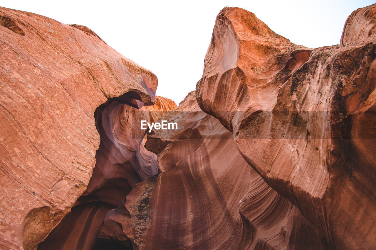 Low angle view of rock formation against sky