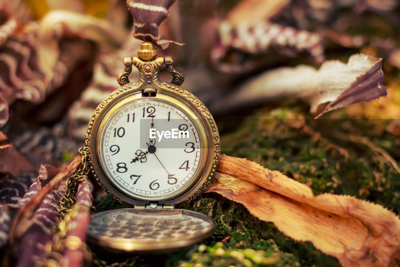 CLOSE-UP OF CLOCK ON METAL