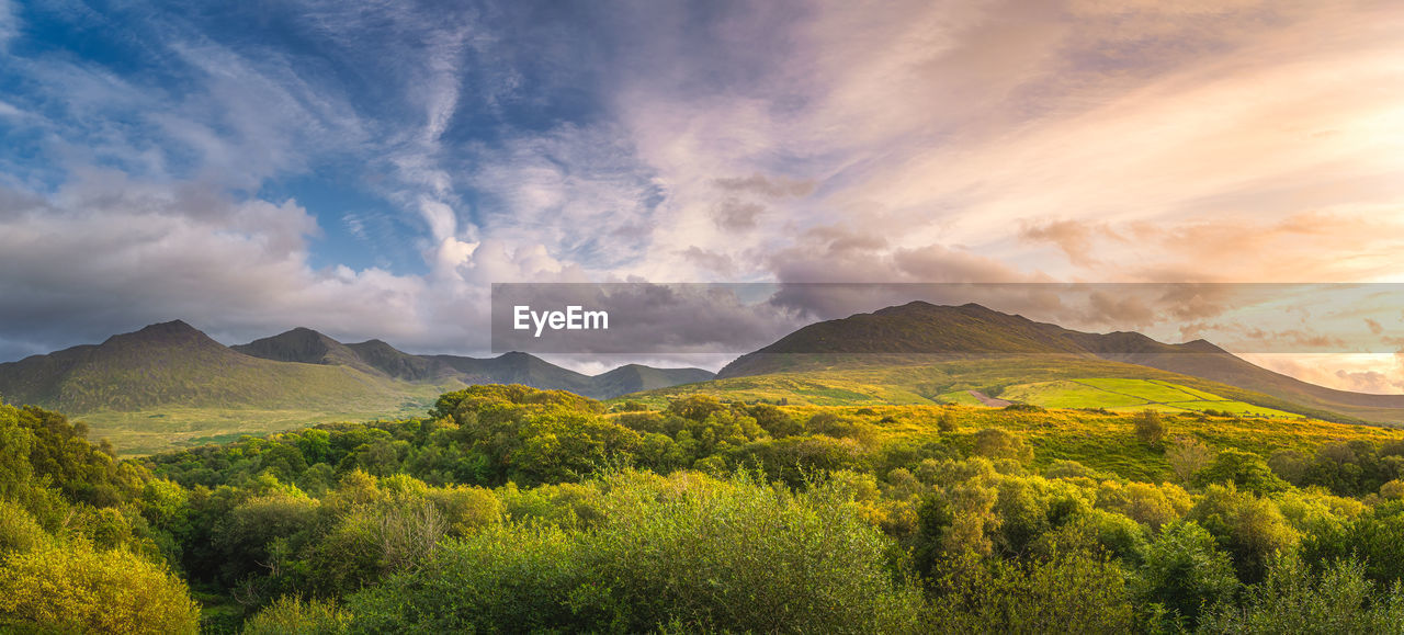 Sunset and dramatic sky at the foothill of carrauntoohil mountain, ring of kerry, ireland