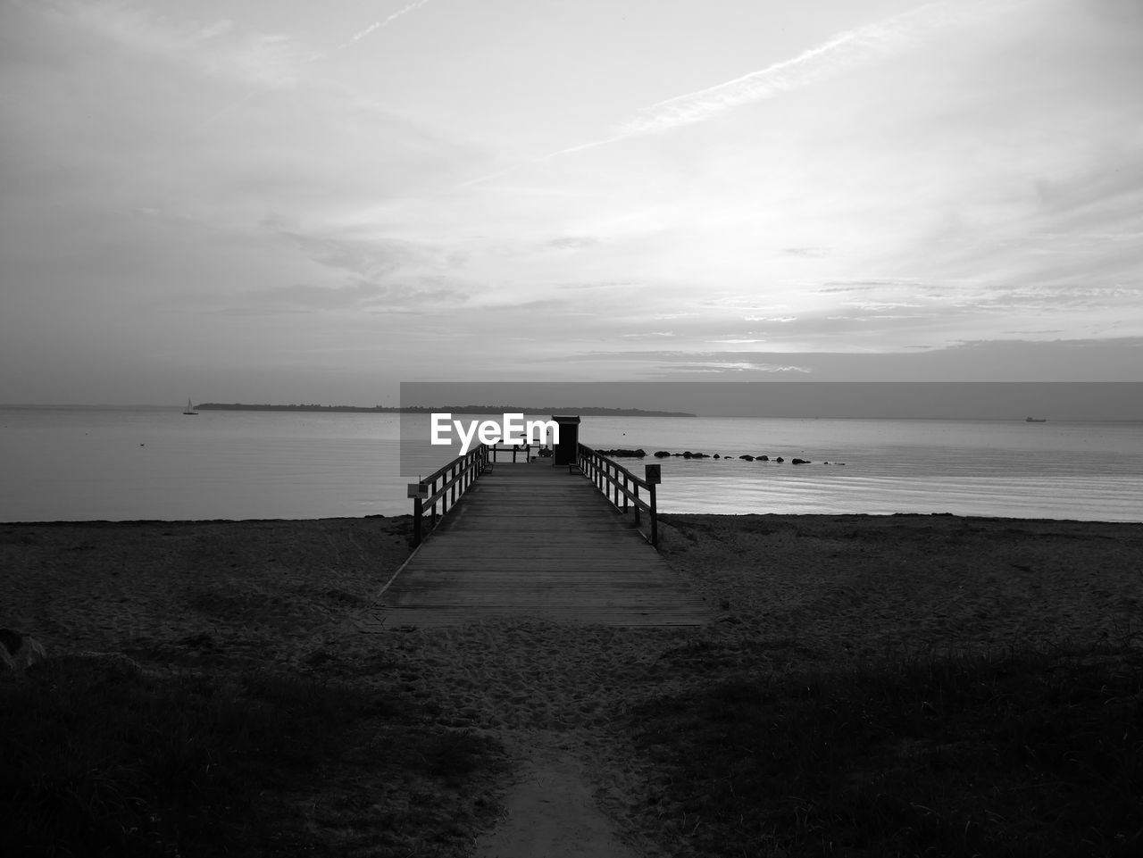 Pier over sea against sky