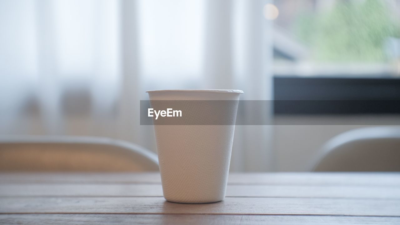 Close-up of coffee cup on table