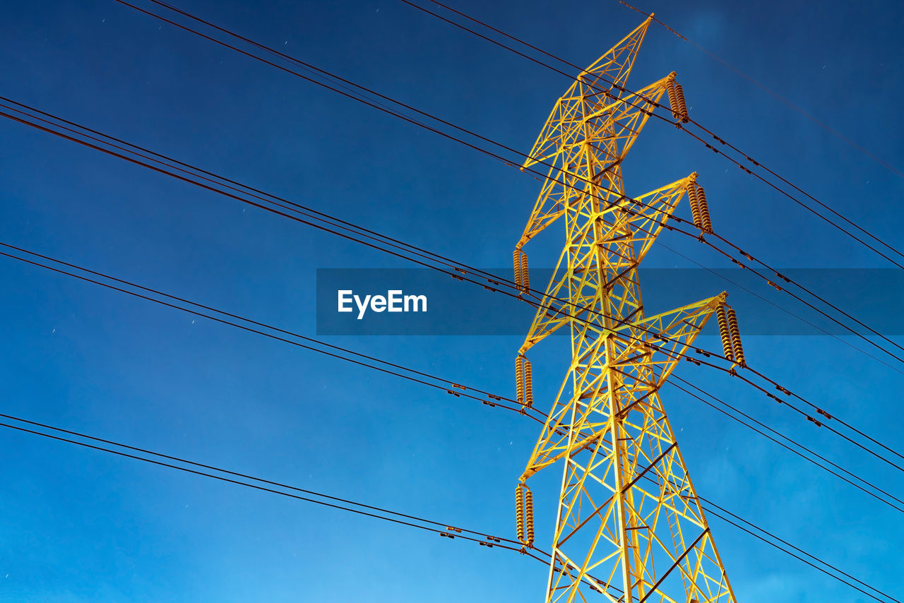 LOW ANGLE VIEW OF POWER LINES AGAINST SKY