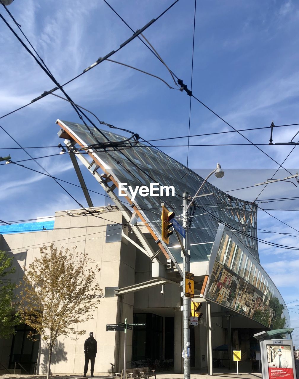 LOW ANGLE VIEW OF ELECTRICITY PYLON IN CITY