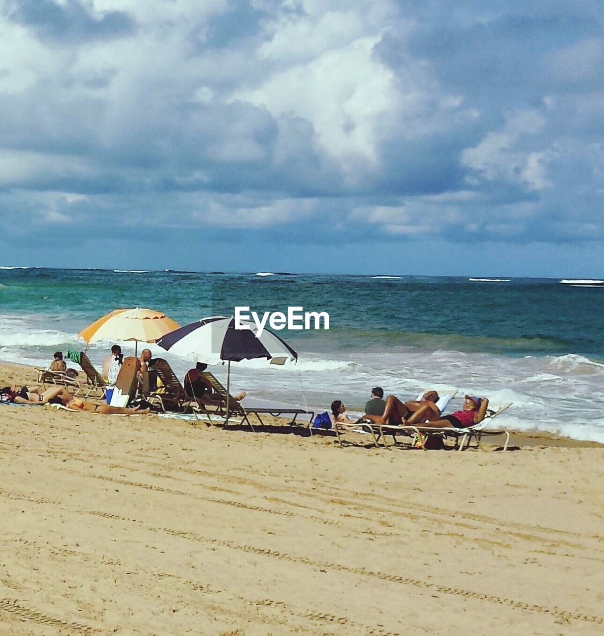 People relaxing at beach