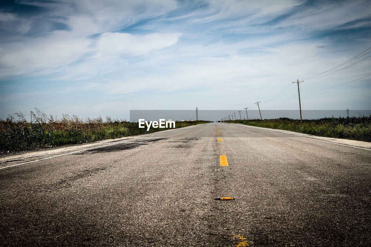 View of empty road passing through landscape