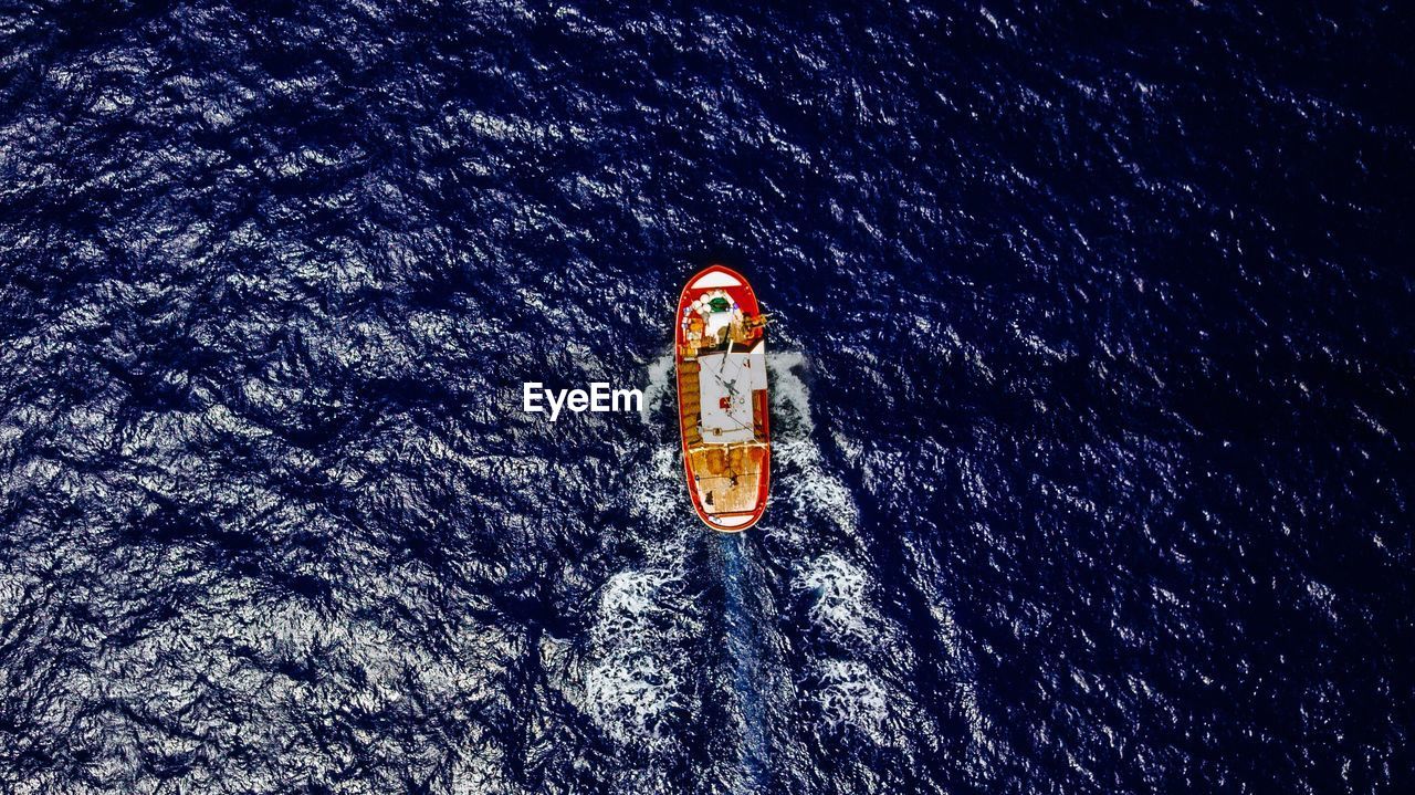 SCENIC VIEW OF SEA AGAINST STAR BOAT