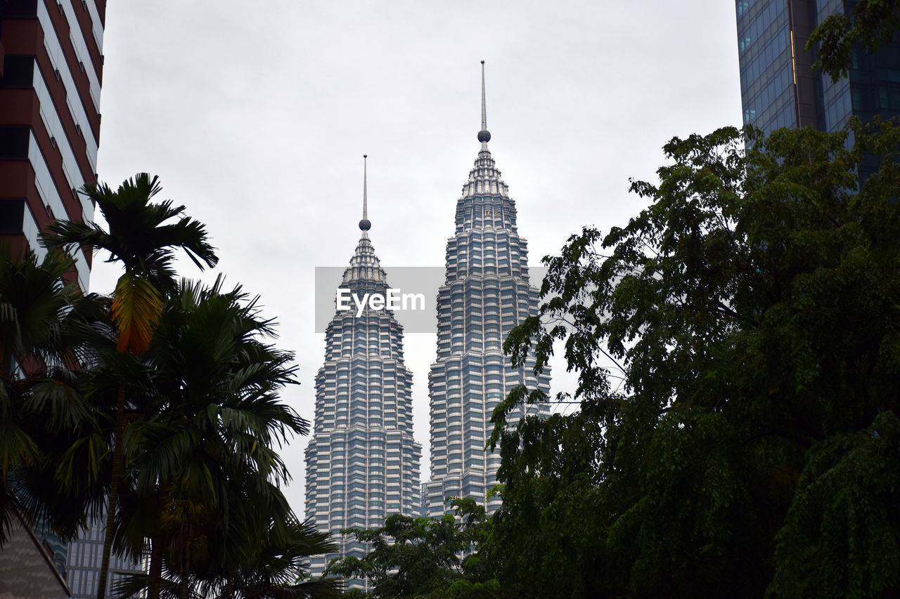 Spires of the petronas twin towers with cloudy background during a rainy day