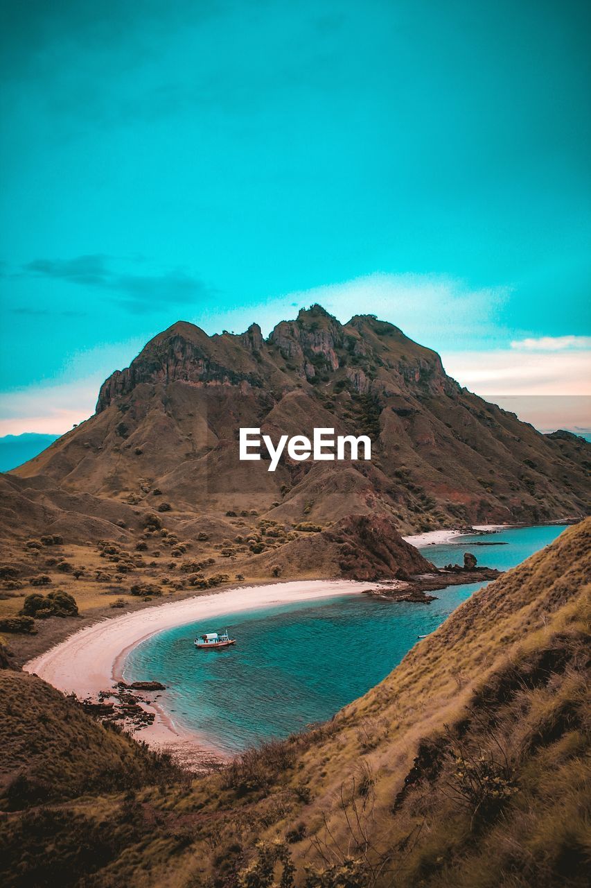 Scenic view of sea against blue sky