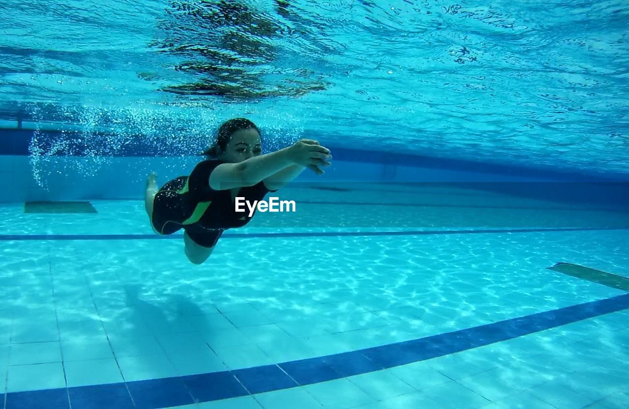 Woman swimming in pool