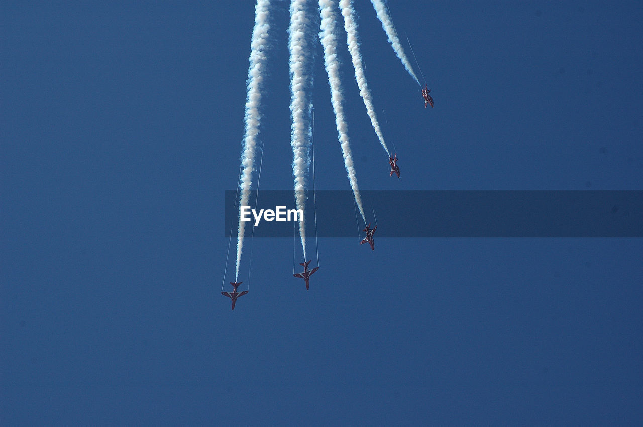 Close-up of airshow against clear sky