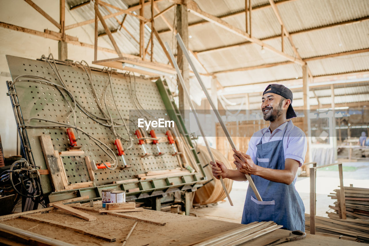 portrait of young man working at construction site