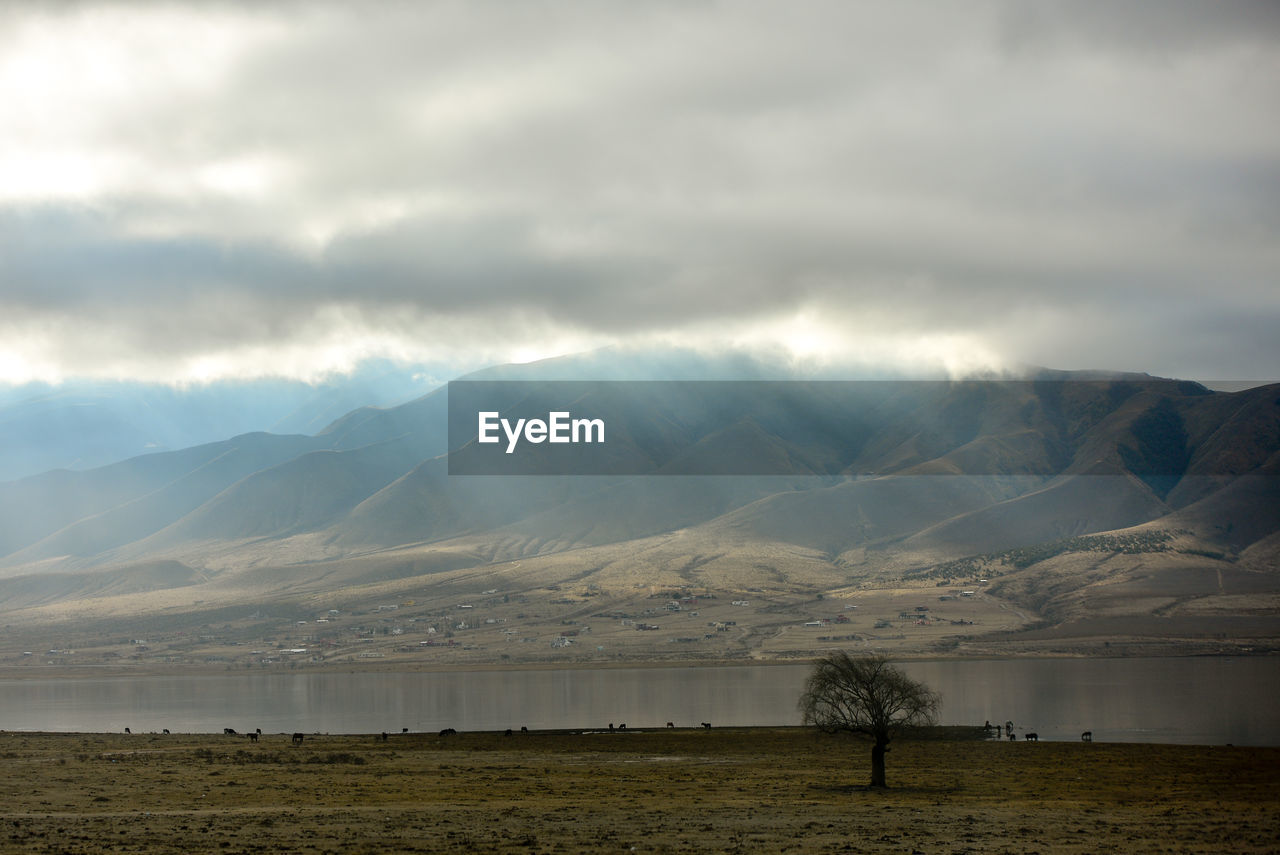 Cloudscape over river and mountain