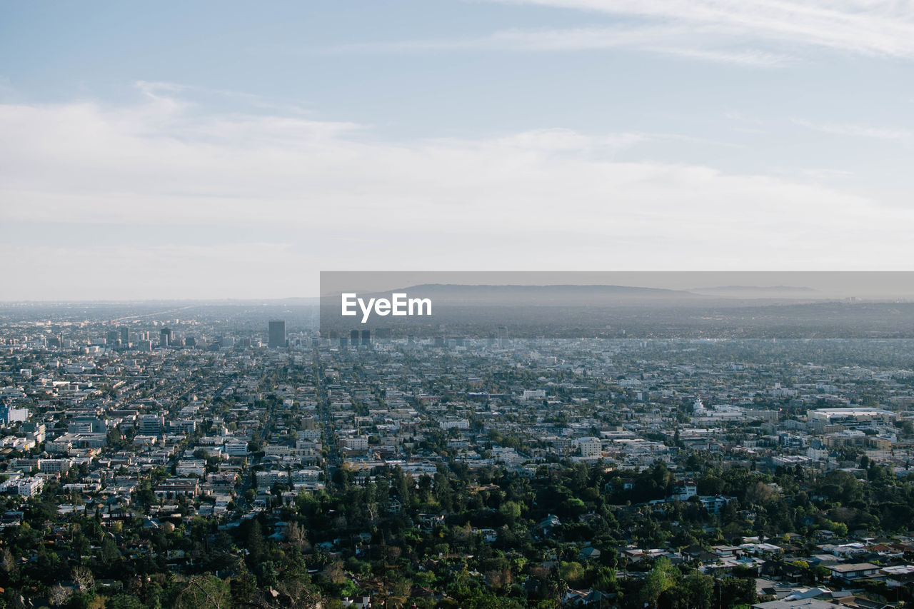 Aerial view of cityscape against sky