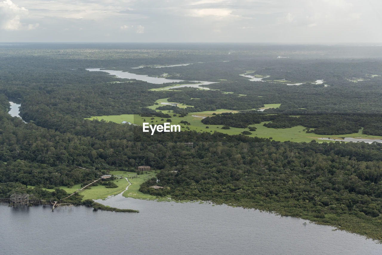 Beautiful aerial view to flooded green amazon rainforest and river