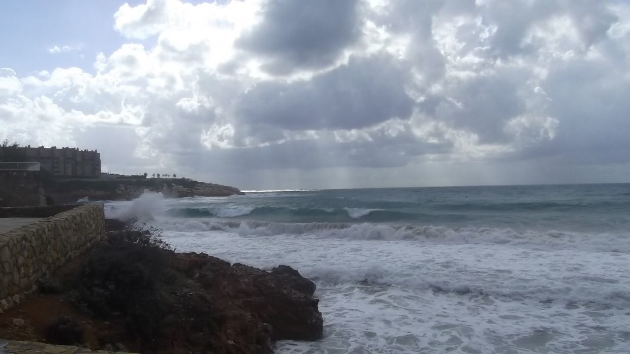 VIEW OF SEA AGAINST CLOUDY SKY