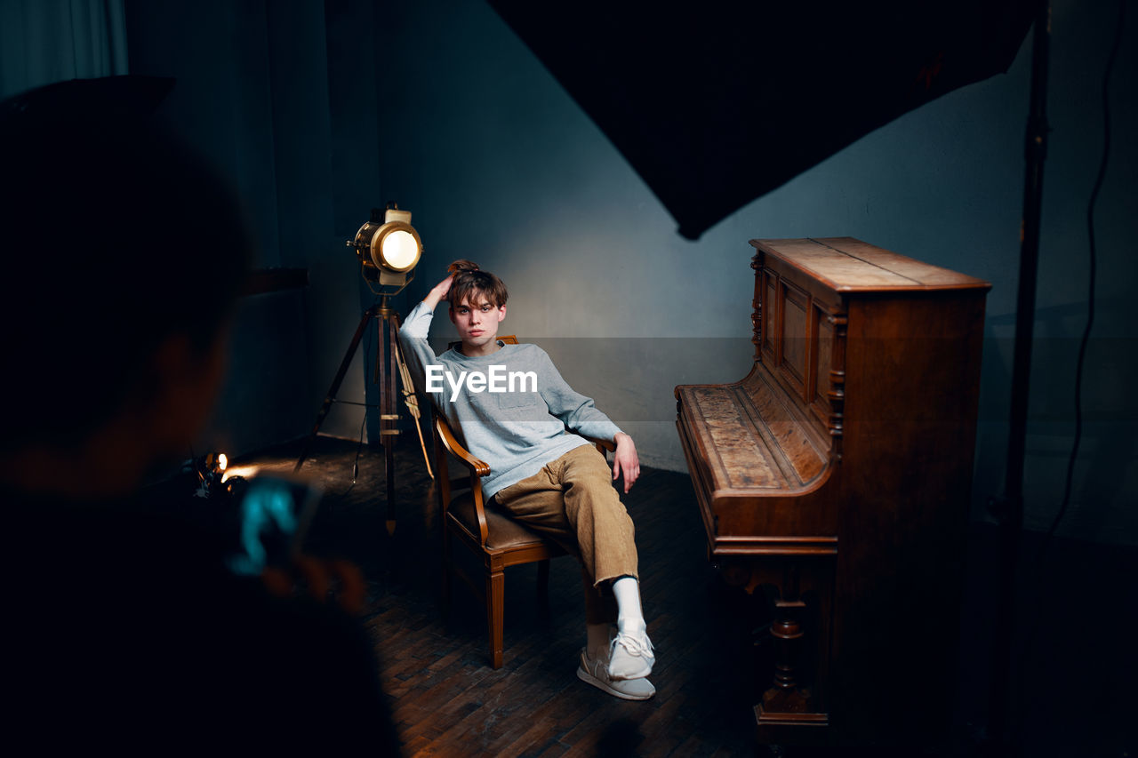 Man sitting on chair at home