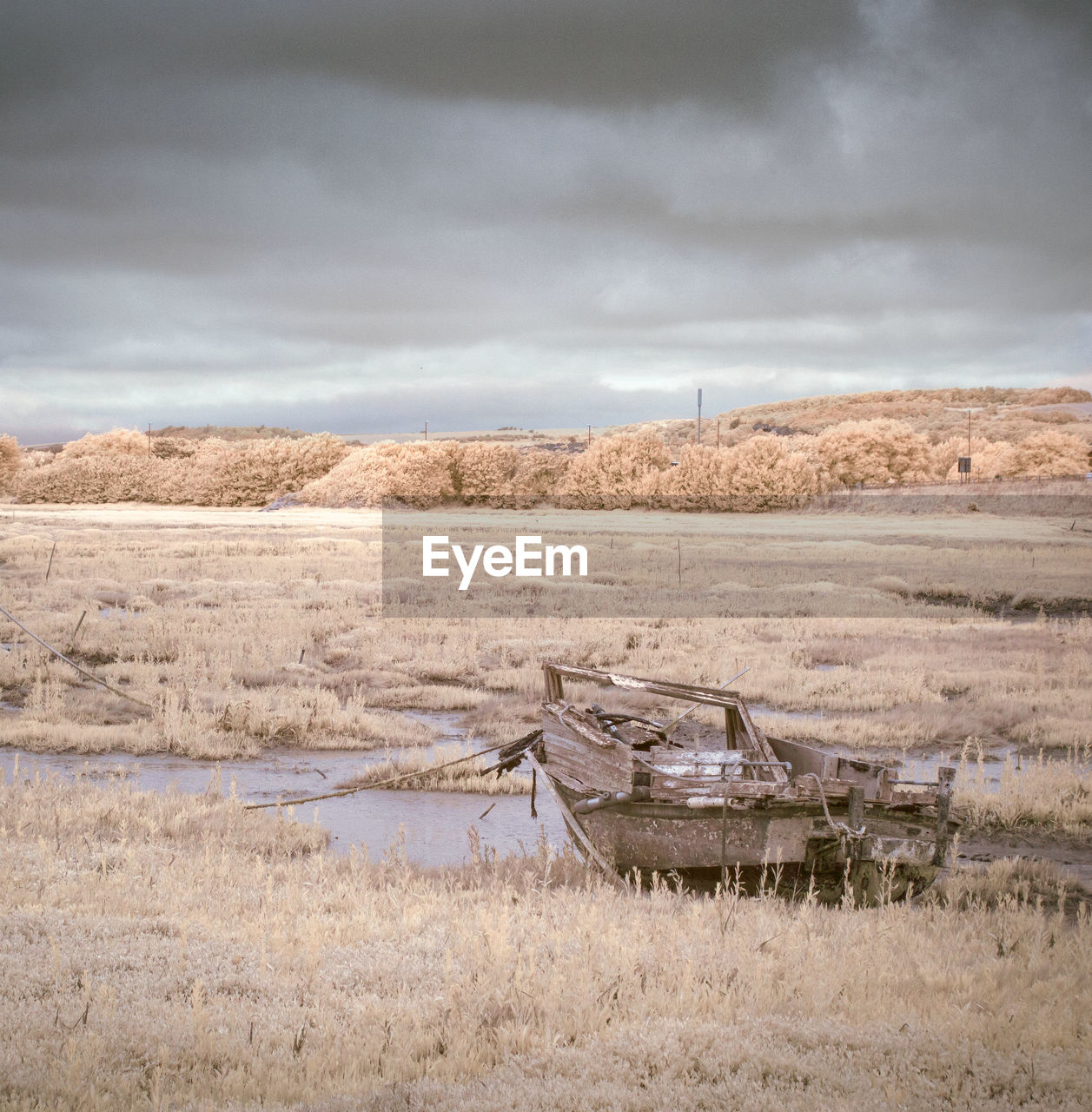 Infrared image of abandoned boat on grassy field