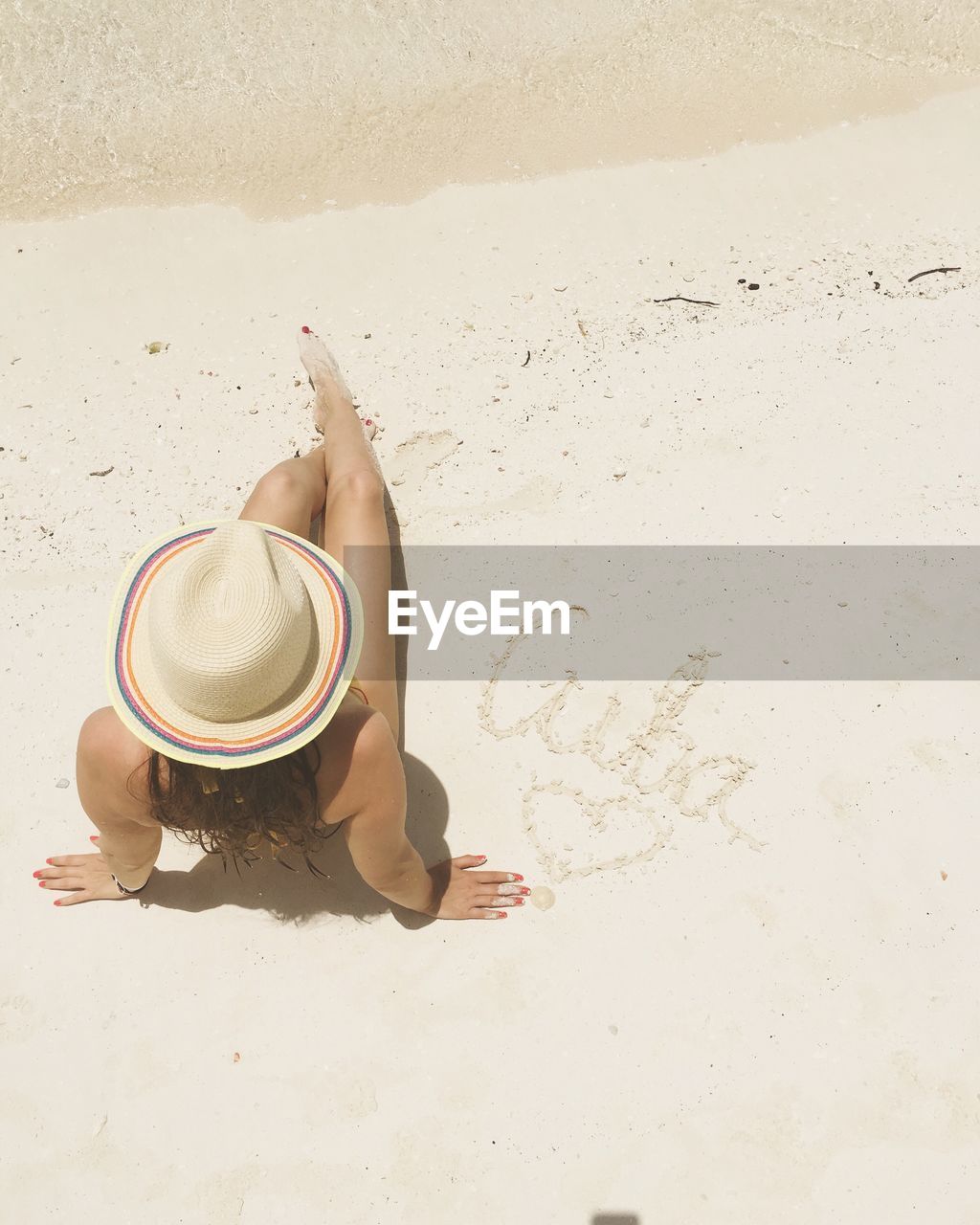 Young woman lying on beach