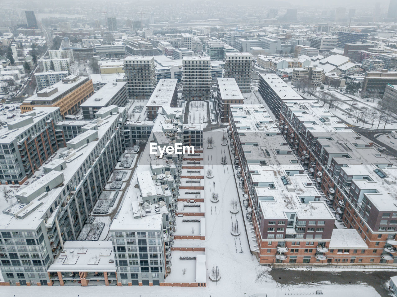 High angle view of buildings in city during winter