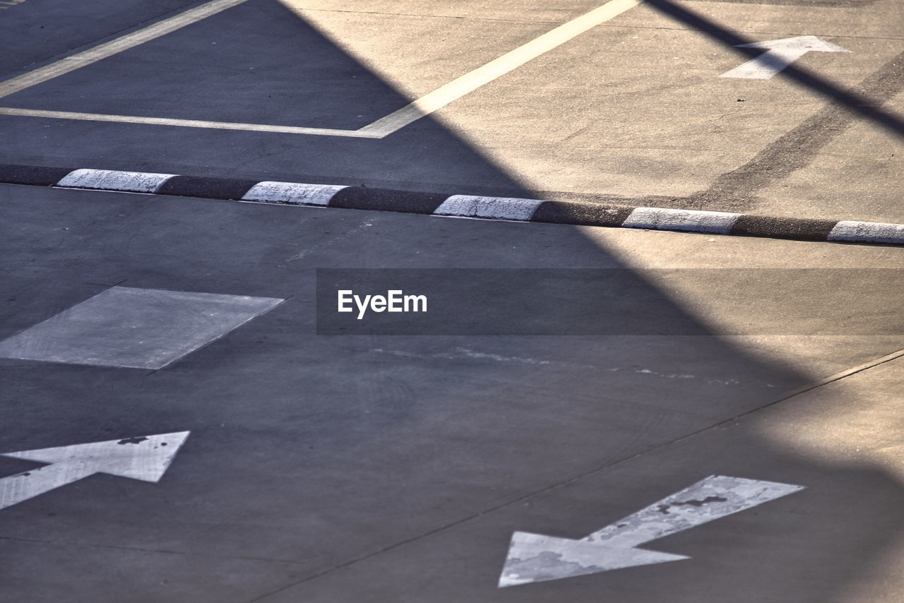 High angle view of speed bump on road in city