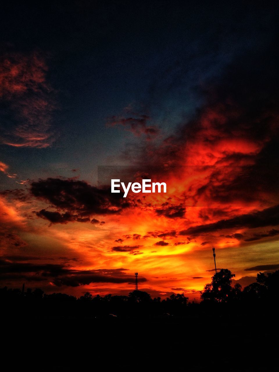 LOW ANGLE VIEW OF DRAMATIC SKY OVER SILHOUETTE LANDSCAPE