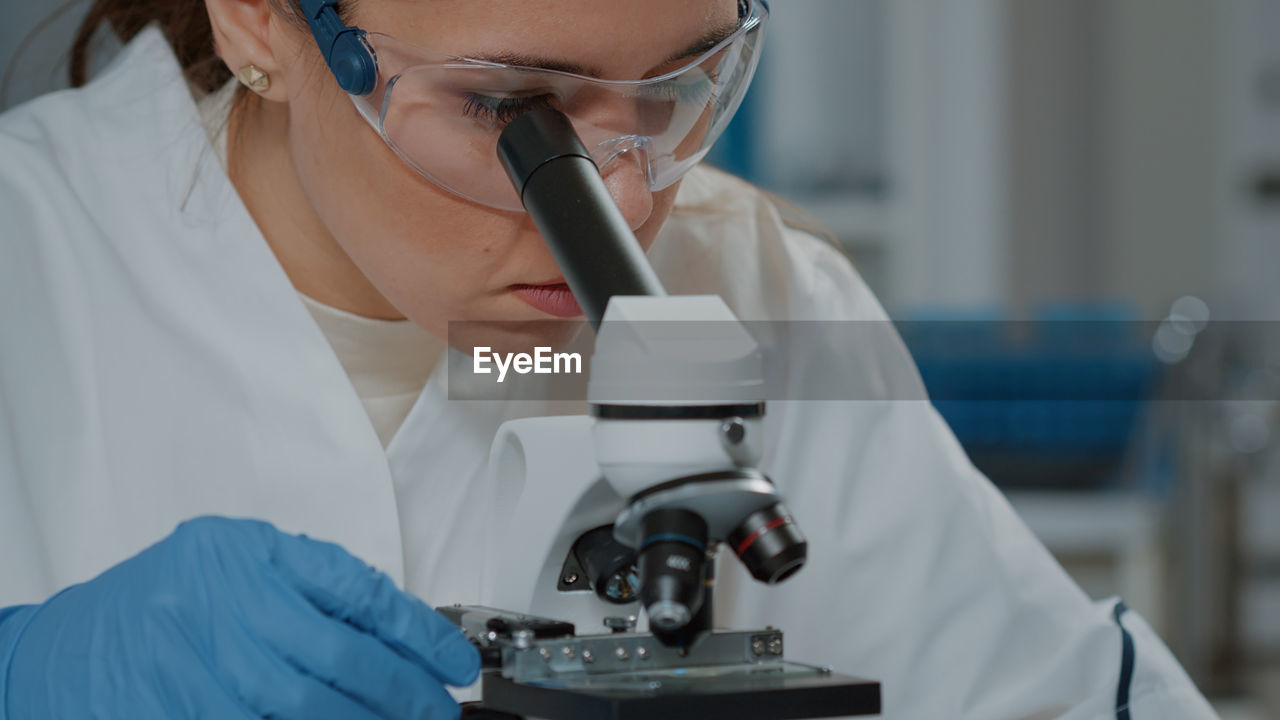 Female scientist experimenting at lab