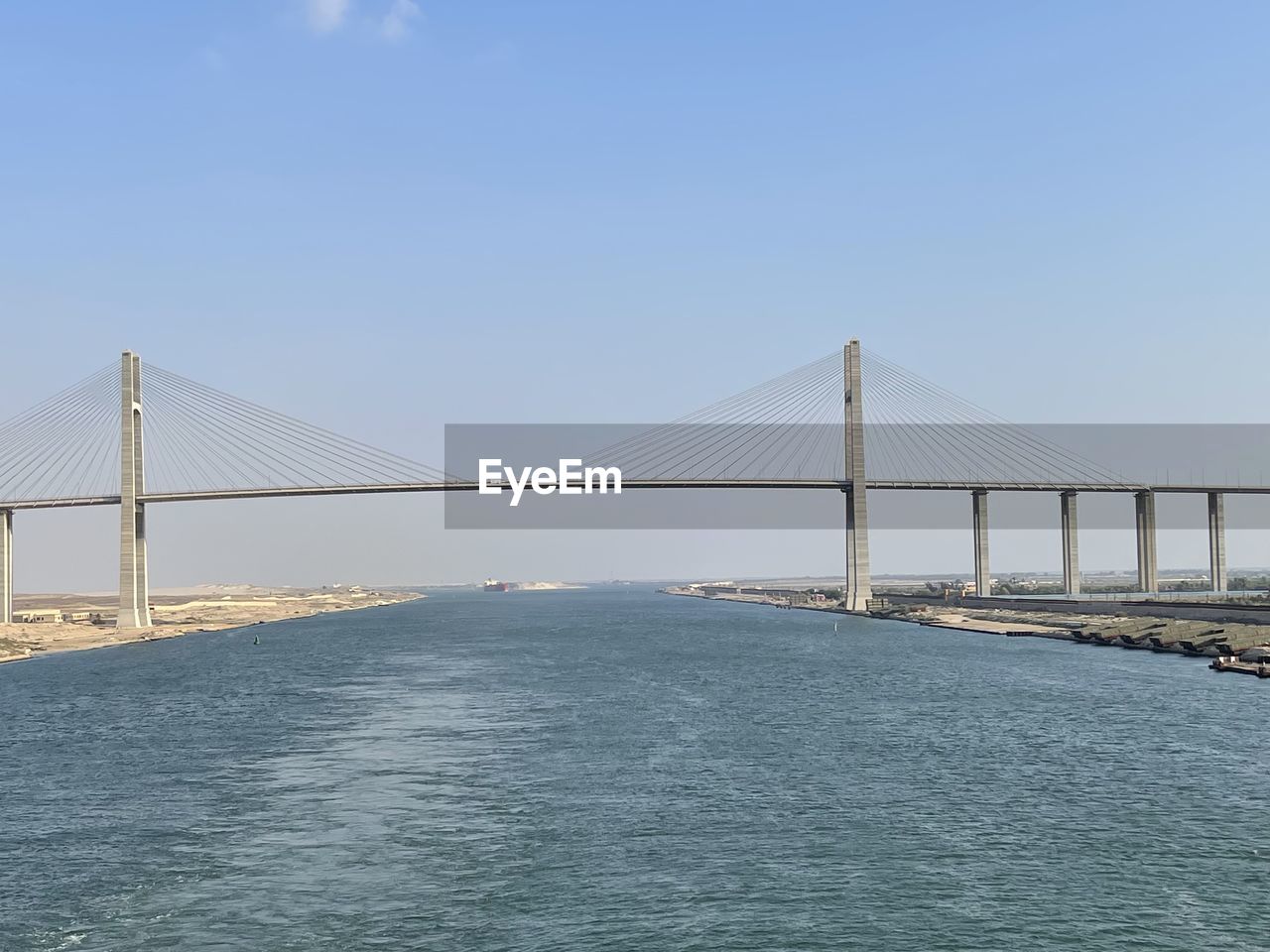 bridge, built structure, architecture, water, suspension bridge, transportation, sky, travel destinations, sea, travel, engineering, cable-stayed bridge, nature, tourism, city, copy space, bay, blue, scenics - nature, bay of water, beauty in nature, day, clear sky, outdoors, tranquility, waterfront, cityscape, building exterior, tranquil scene, sunlight, horizon, sunny, urban skyline, landscape, environment, long, road, beach, land, cloud, crossing, coastline, idyllic