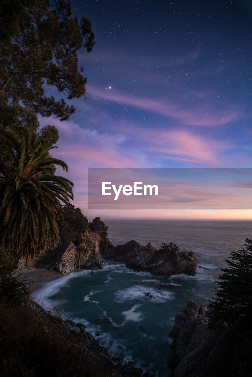 Scenic view of sea against sky at night