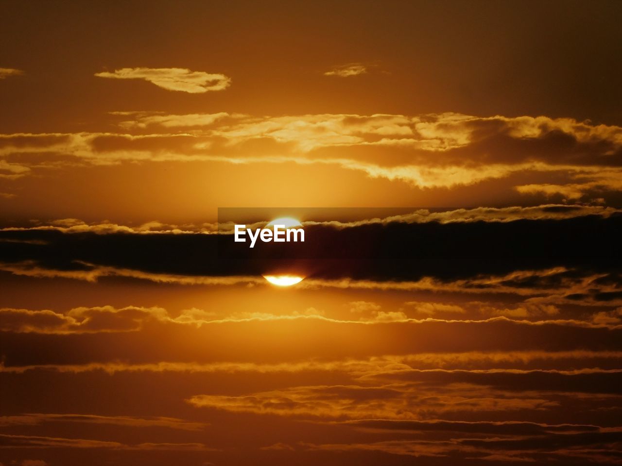 Scenic view of dramatic sky during sunset