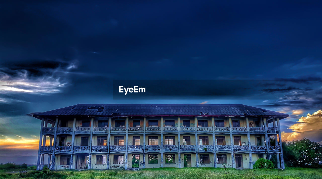 Building against cloudy sky