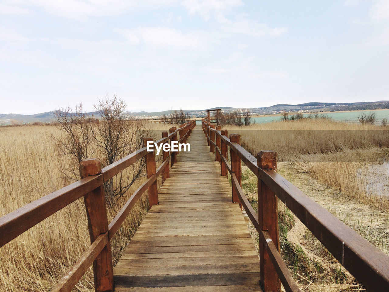 Vrana lake in croatia, natural birds reservat, a straight forward, wooden bridge under the water