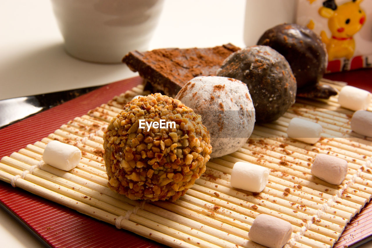 CLOSE-UP OF BREAD AND VEGETABLES ON TABLE