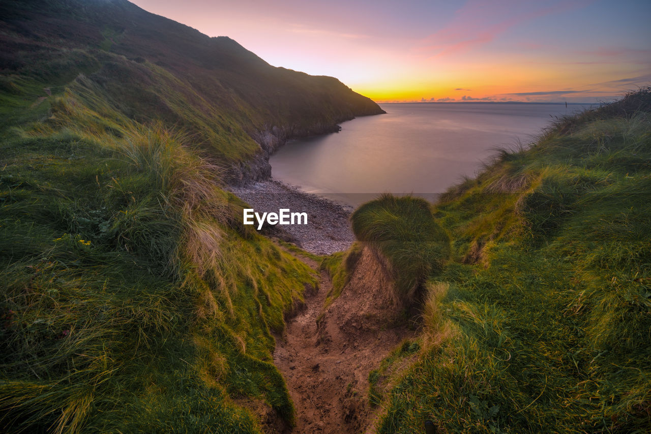 Scenic view of sea against sky during sunset