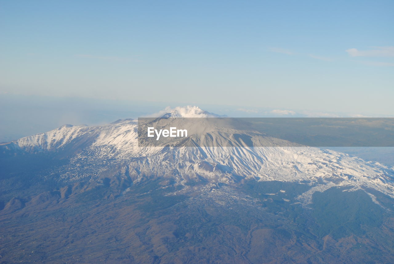 Scenic view of snow mountains against sky