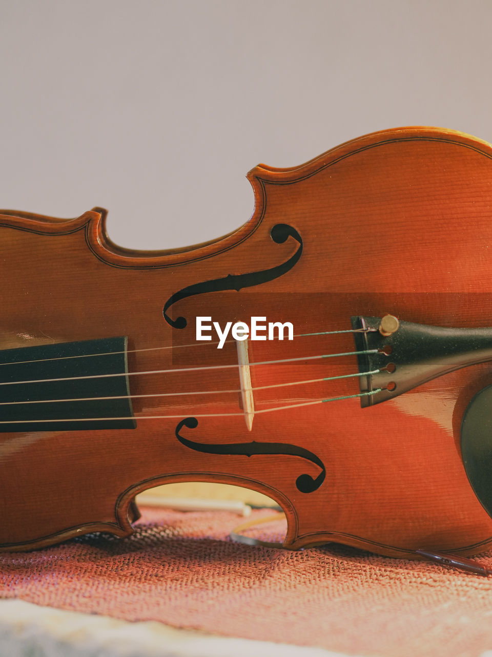 Close-up of violin against white background