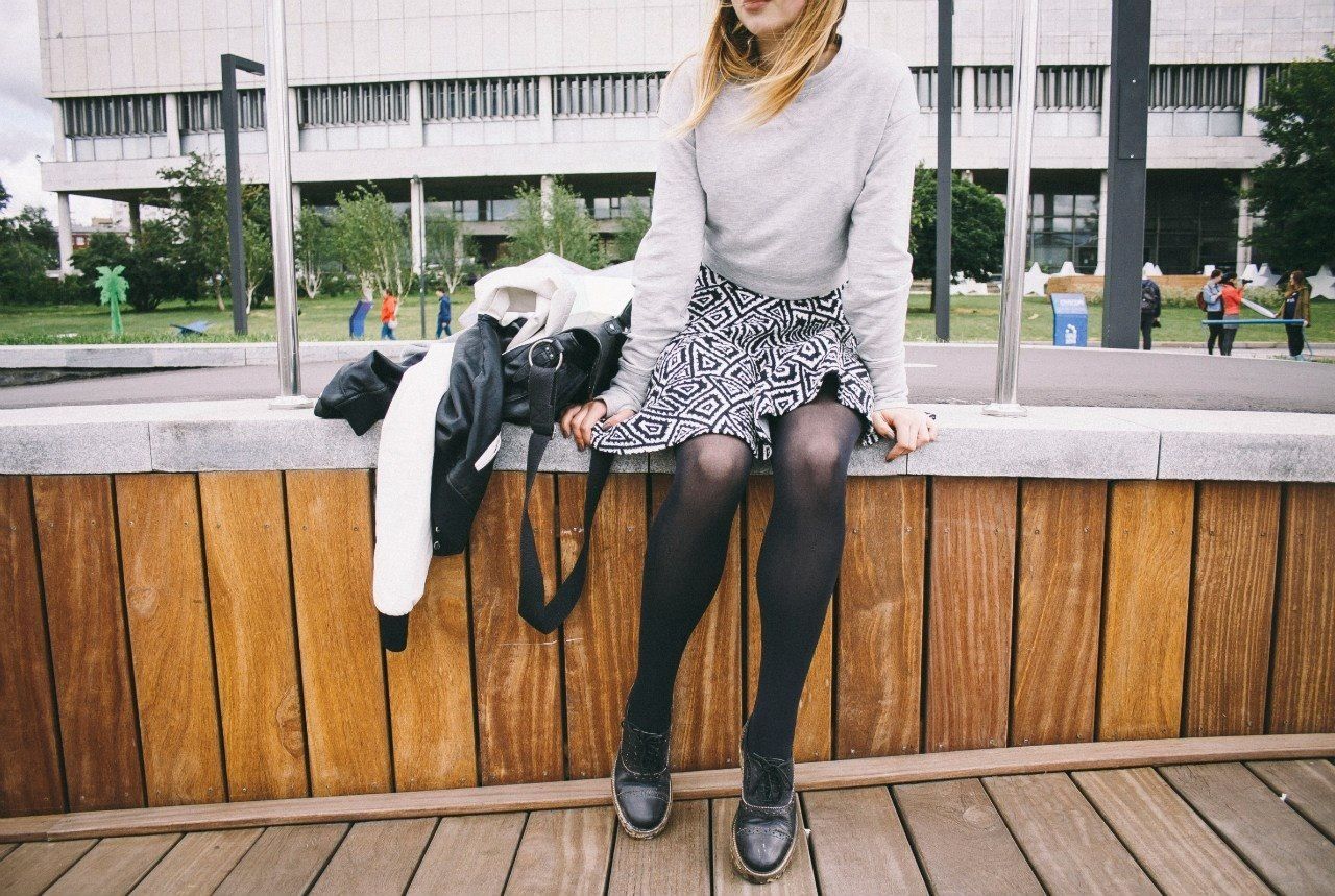 WOMAN STANDING IN PARK