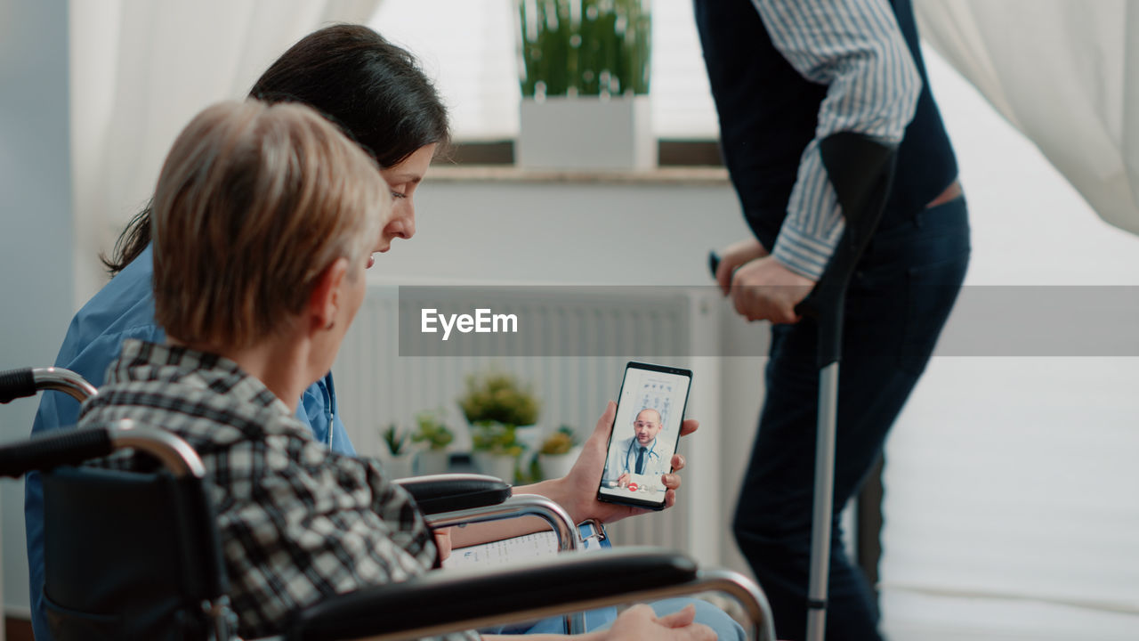 Doctor consulting patient on video call