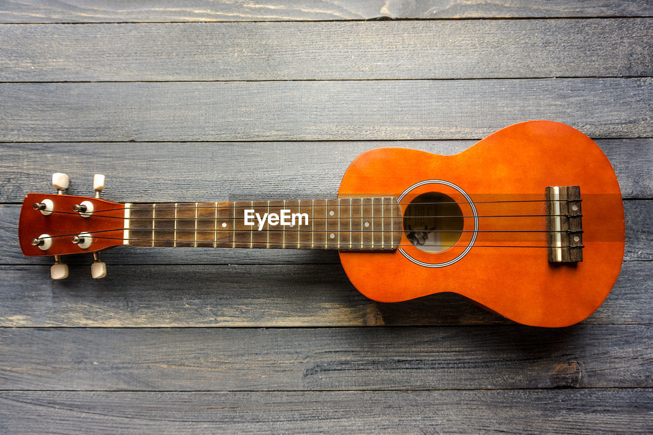 Close-up of guitar on table