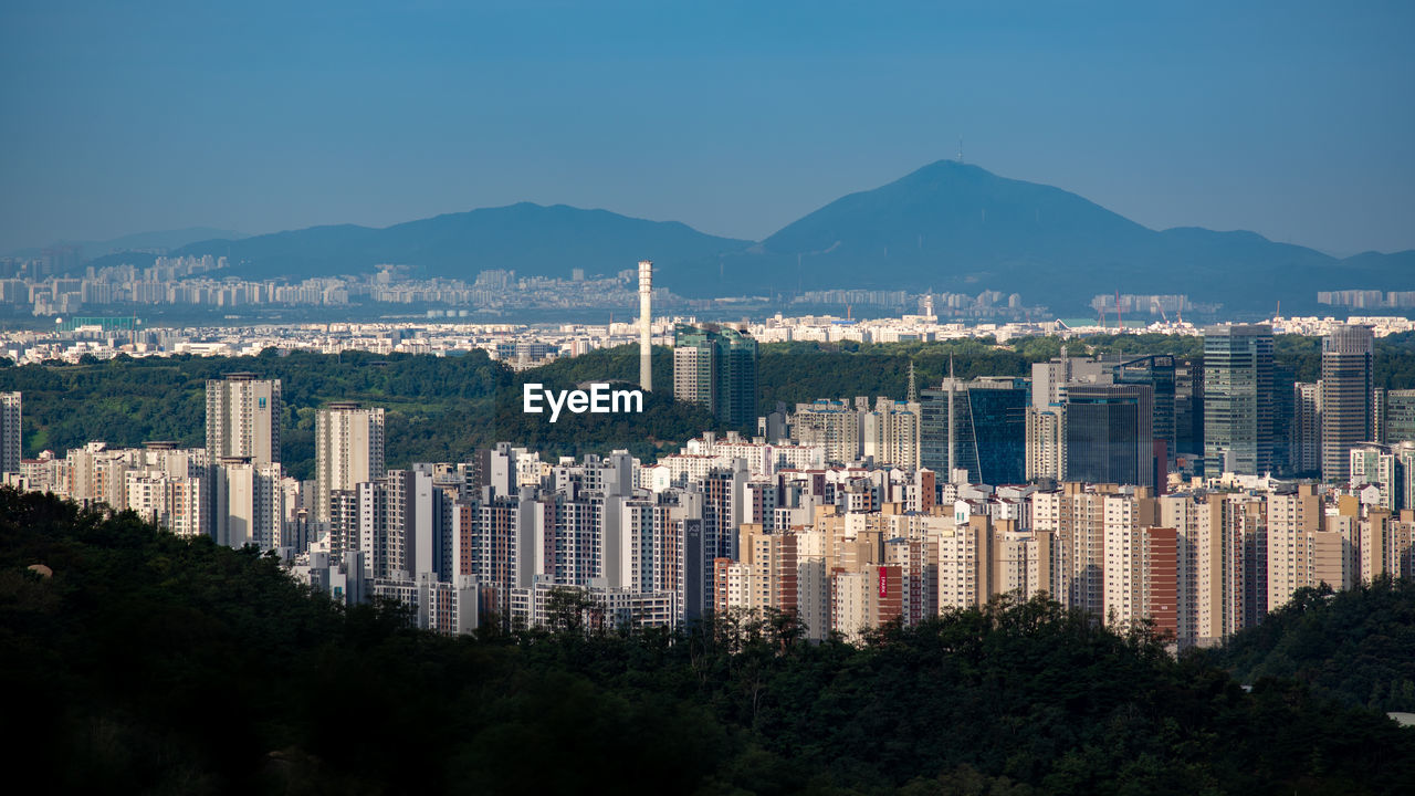 buildings in city against sky