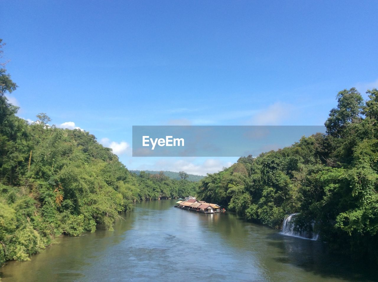 River amidst trees in kanchanaburi