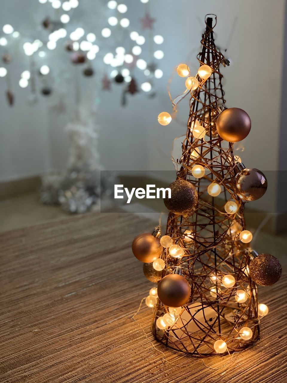 Close-up of illuminated christmas lights on table at home