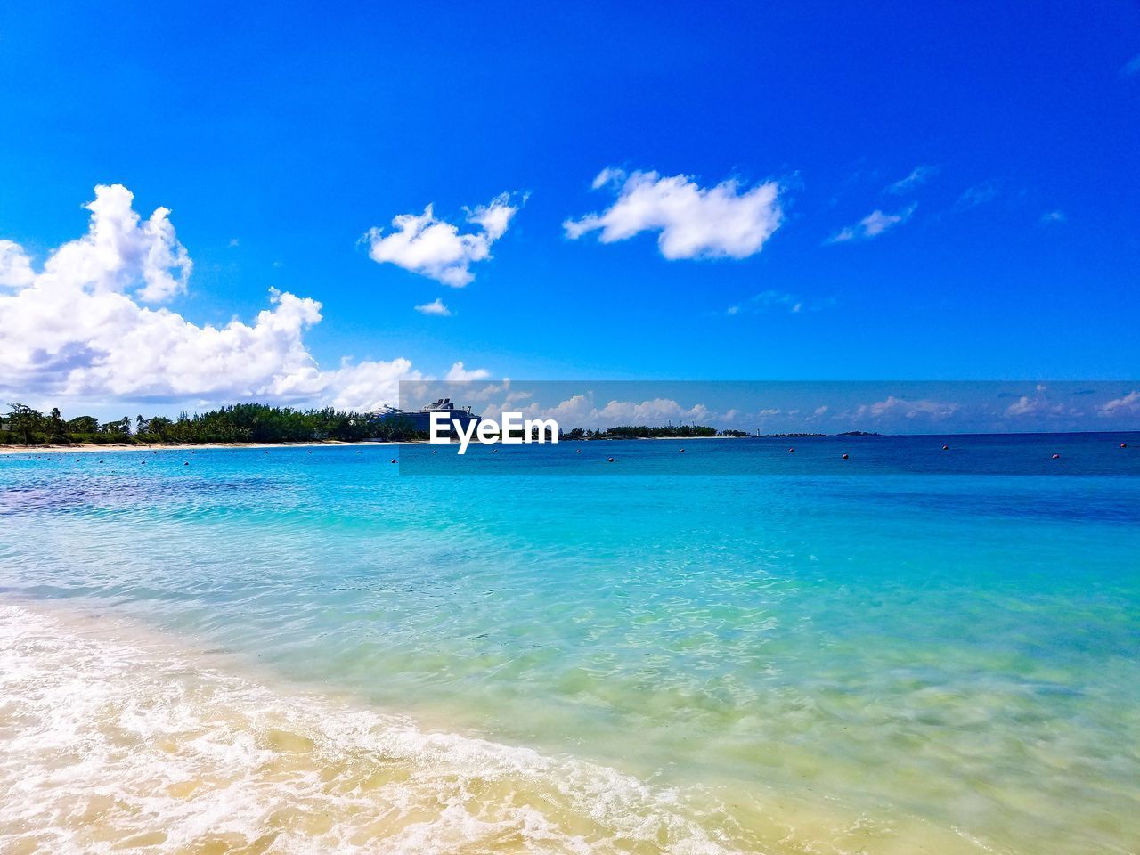 Scenic view of sea against blue sky