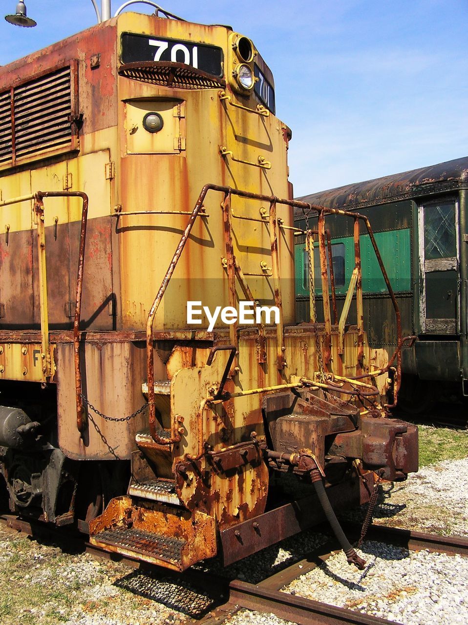 ABANDONED TRAIN ON RAILROAD TRACKS