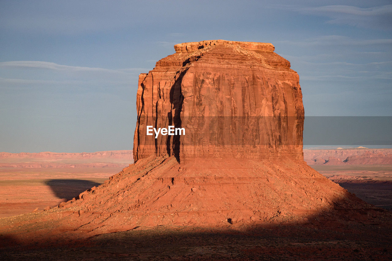 rock formations on desert against sky